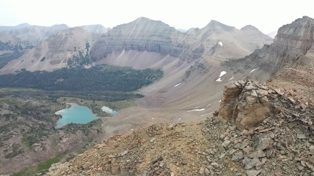 Mountain lake reflecting autumn colors in a high-elevation wilderness