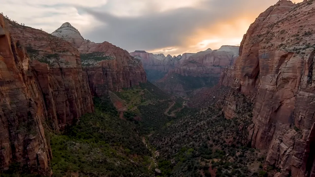 Vast canyon walls and a river running through a canyon landscape